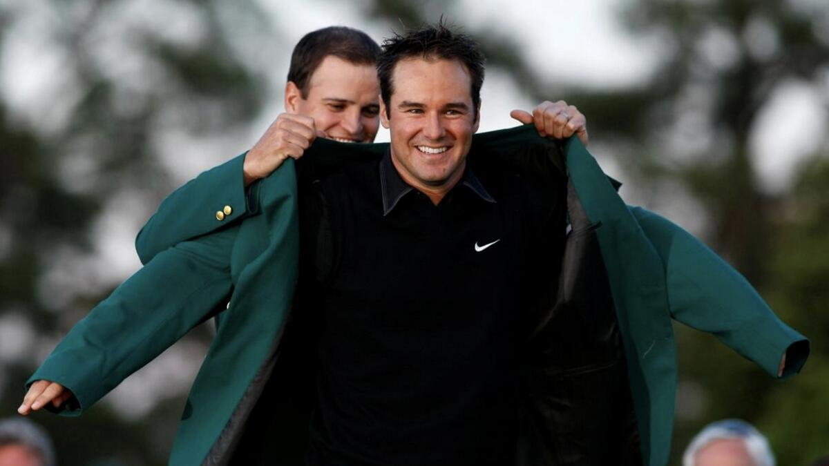 Trevor Immelman (right) of South Africa receives the Green Jacket from former champion Zach Johnson after winning the the 2008 Masters. - Reuters file