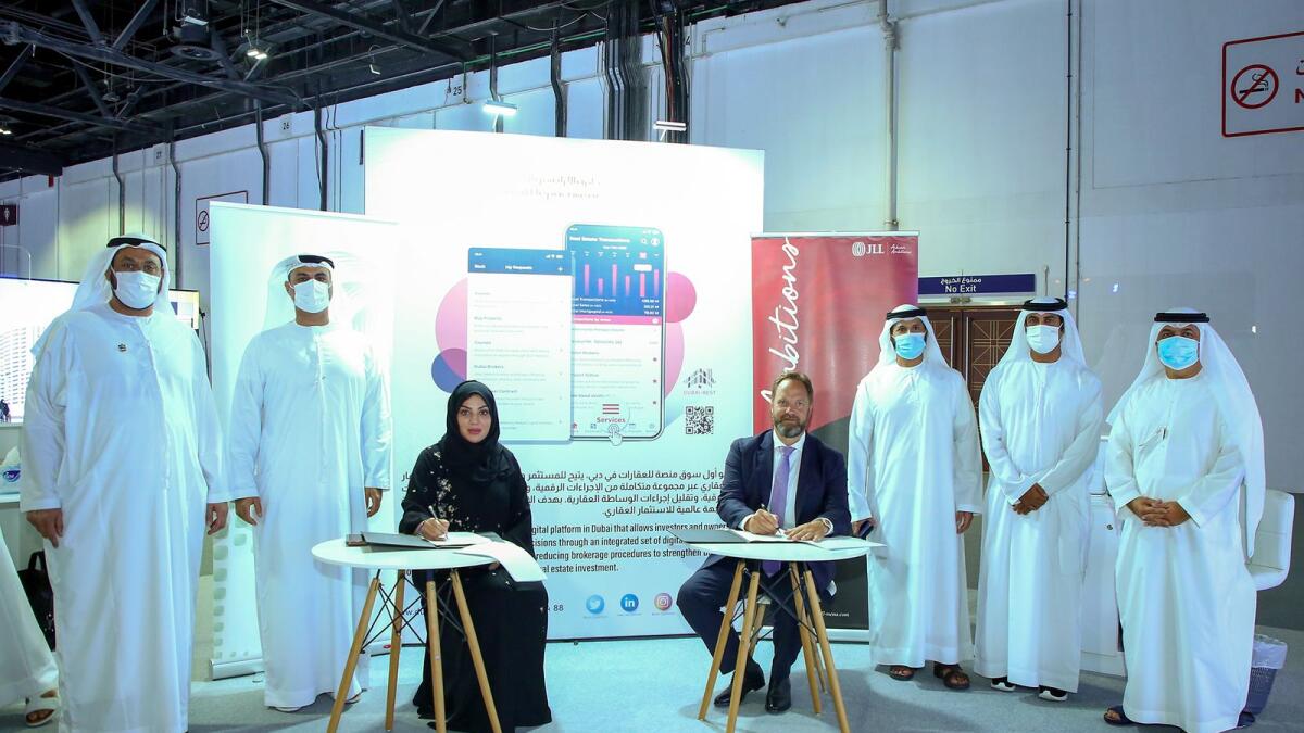 Majida Ali Rashid, CEO of the Real Estate Promotion and Investment Management Sector at DLD, signed the MoU on behalf of DLD while Thierry Delvaux, CEO of JLL MEA, signed on be-half of JLL. — Supplied photo