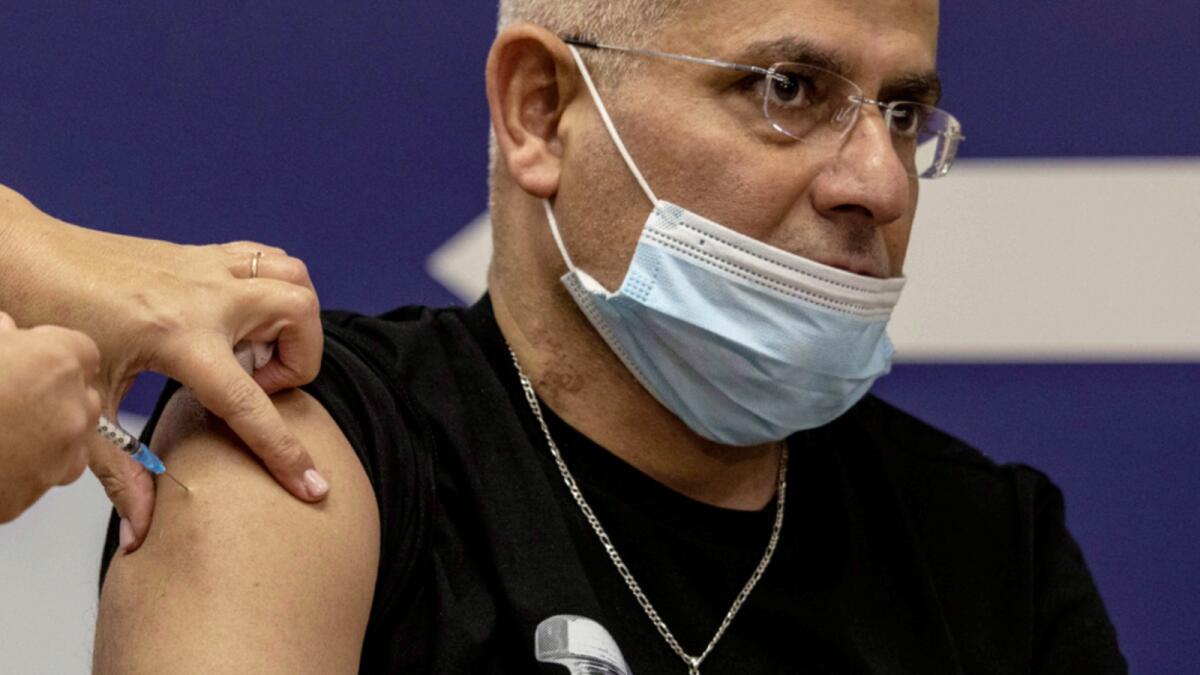 An Israeli man receives the fourth dose of the Pfizer-BioNTech Covid-19 vaccine at the Sheba Medical Center in Ramat Gan. — AP