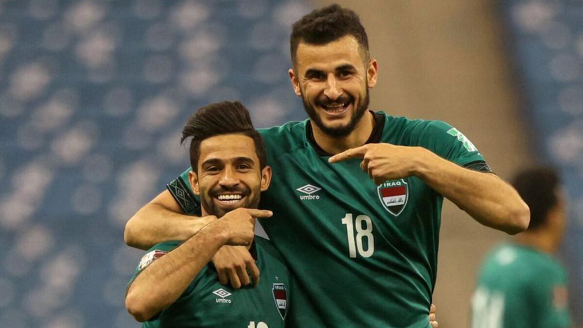 Iraq's Hussein Ali (left) celebrates his goal with Aymen Hussein during the match against UAE. (AFC website)