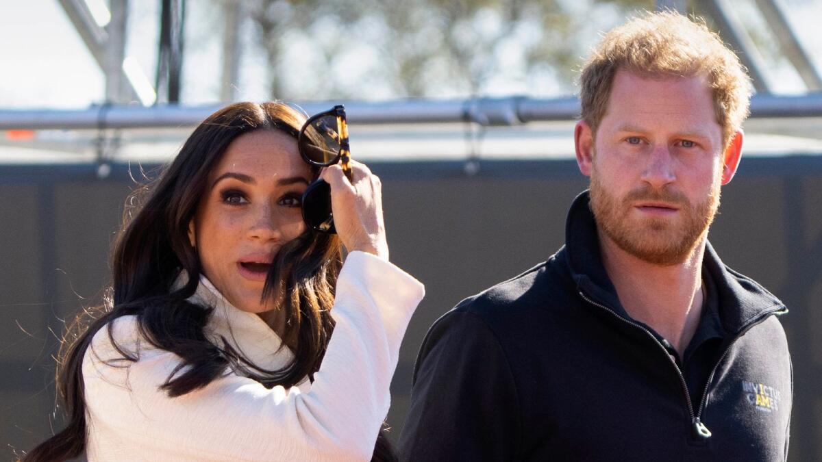 Prince Harry and Meghan Markle visit the track and field event at the Invictus Games in The Hague, Netherlands on  April 17, 2022. — AP file