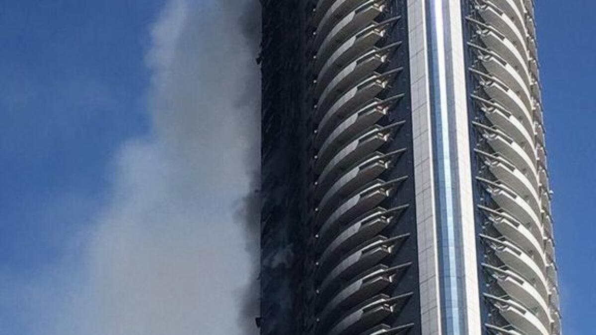 Smoke still billows from Dubai hotel