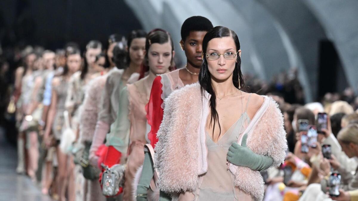 US model Bella Hadid (C) and models present creations for Fendi during the catwalk show for the Women Fall/Winter 2022/2023 collection on the second day of the Milan Fashion Week in Milan on February 23, 2022.  Photo: AFP