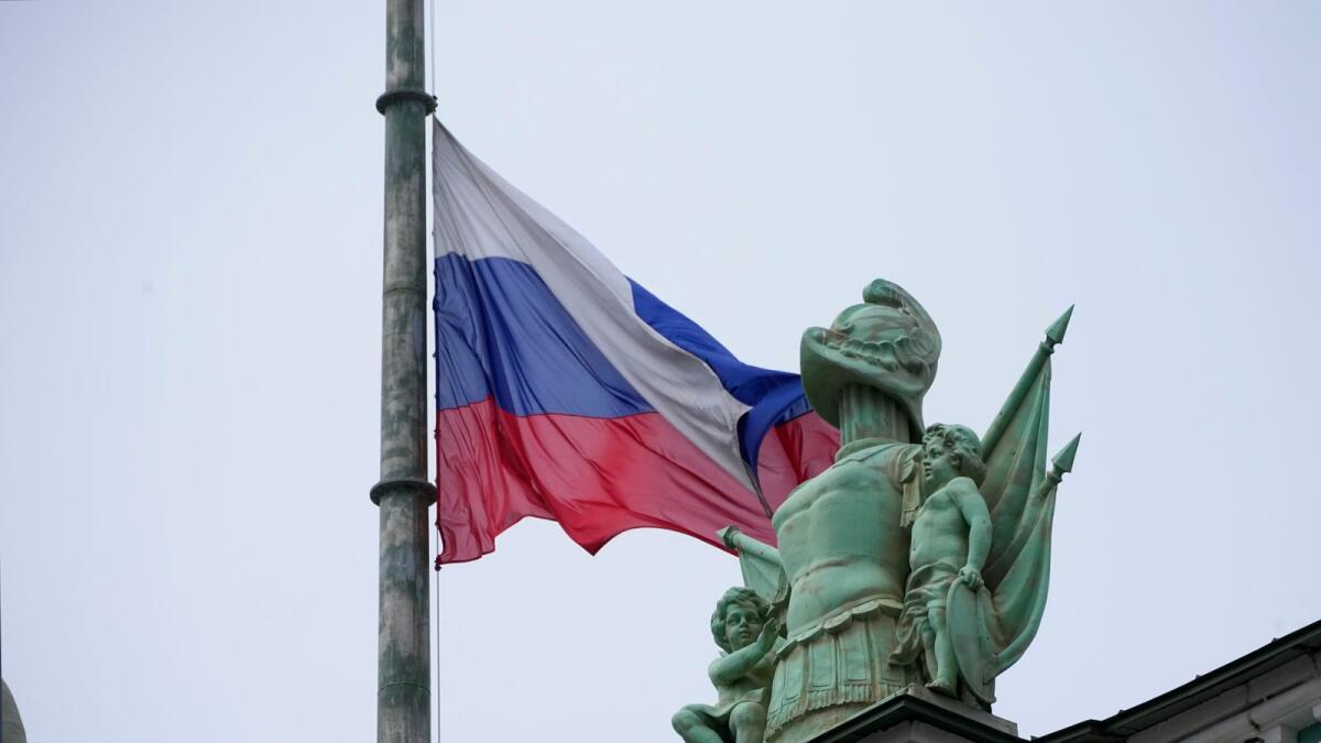 A Russian national flag is at half-mast over the Hermitage Museum in St. Petersburg. — AP