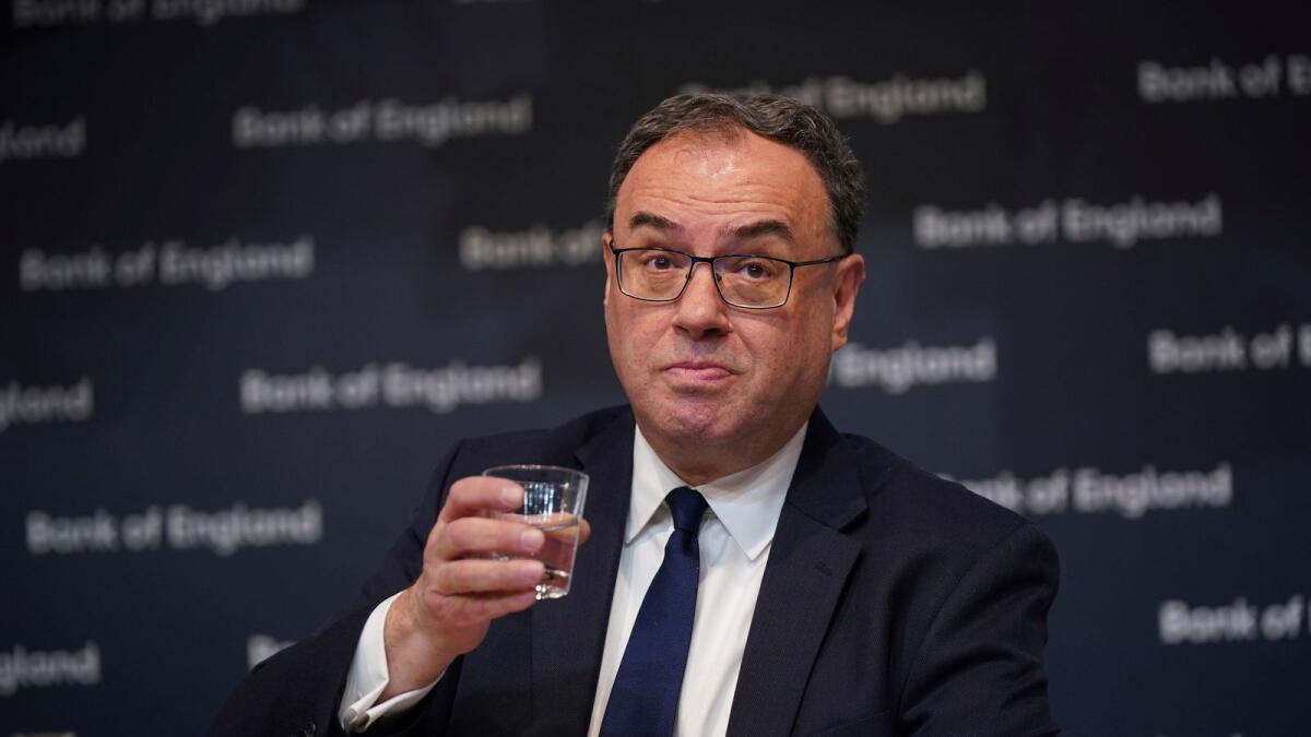 Andrew Bailey, Governor of the Bank of England, holds a cup during the Bank of England Monetary Policy Report press conference at the Bank of England in London, on Thursday, February 2, 2023. — AP