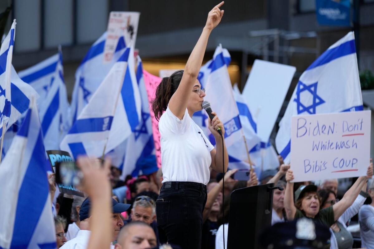 Protesters wave flags and chant slogans near the site of a planned meeting between United States President Joe Biden and Israeli Prime Minister Benjamin Netanyahu in New York, on Wednesday. — AP