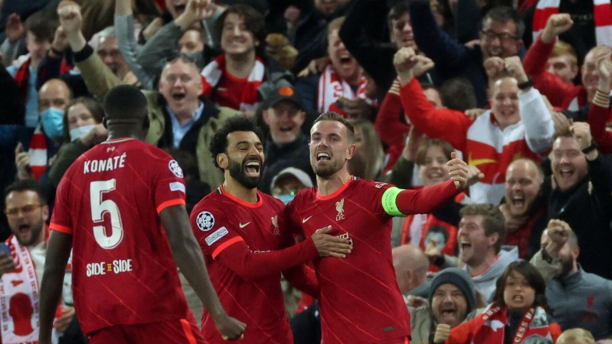 Liverpool's Jordan Henderson (right) celebrates a goal with teammates. (Reuters)