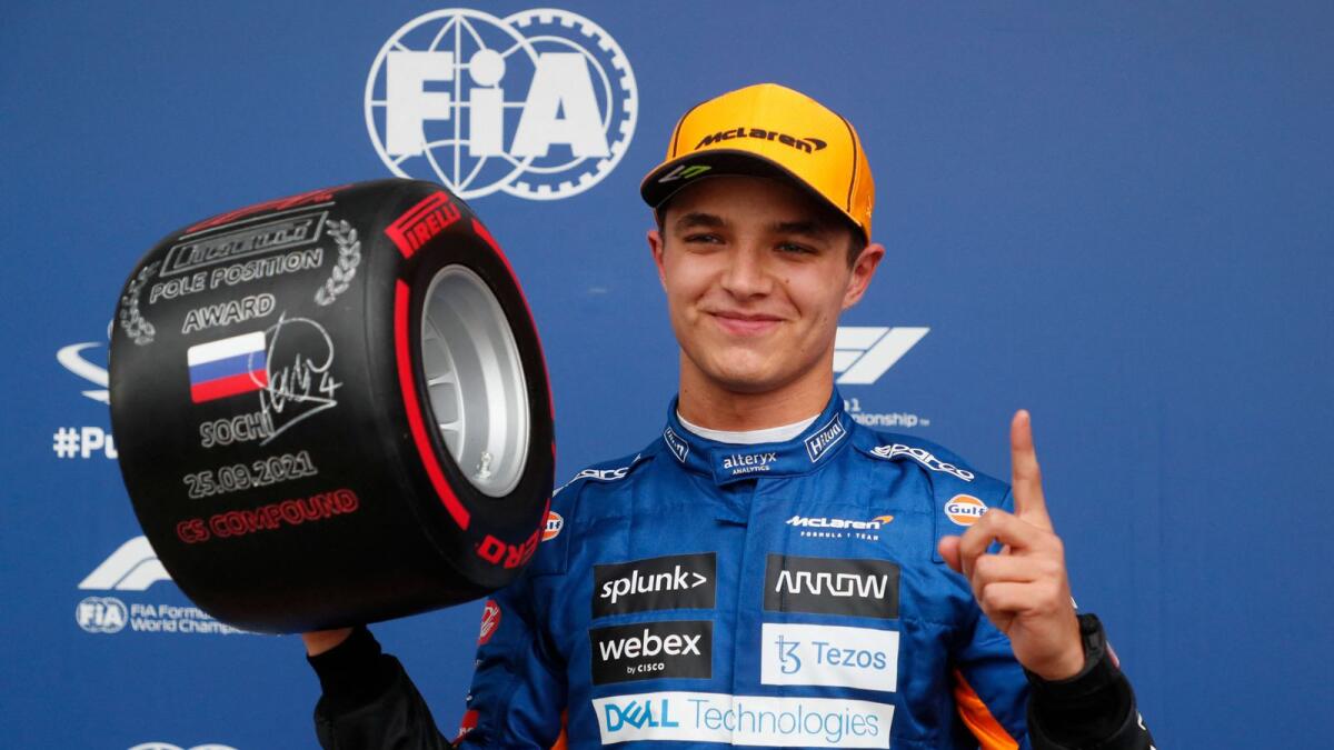 McLaren’s Lando Norris celebrates after taking pole position for the Russian Grand Prix at the Sochi Autodrom circuit on Saturday. — AP