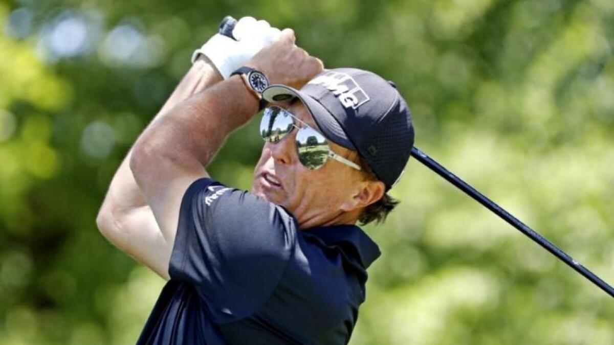 Mickelson closed with a birdie at the last hole of the TPC River Highlands course for a seven-under-par 63 (Reuters)