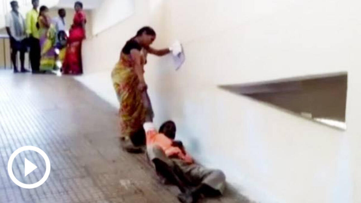 No stretcher, woman forced to drag husband on hospital ramp