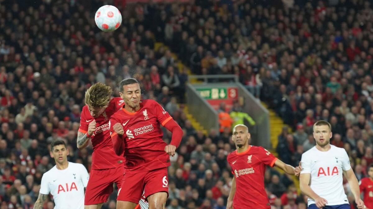 Liverpool's Thiago (right) and Kostas Tsimikas clear the ball during the Premier League  match against Tottenham. (AP)