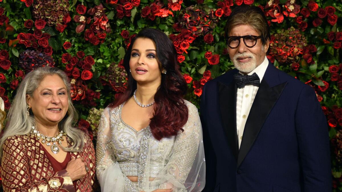 Indian Bollywood actors Jaya Bachchan (L), Aishwarya Rai Bachchan (C) and Amitabh Bachchan (R) pose for a picture during the wedding reception party of actors Ranveer Singh and Deepika Padukone in Mumbai late on December 1, 2018.  / AFP / -