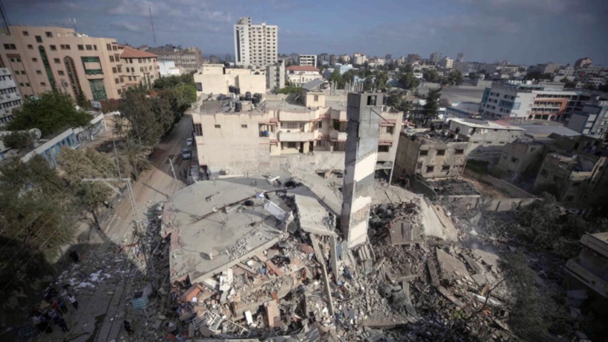 A top view shows the remains of a six-story building which was destroyed by an early morning Israeli airstrike in Gaza City on Tuesday. — AP