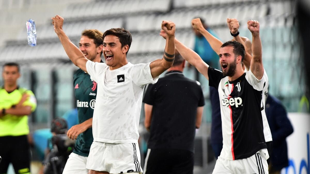 Juventus' Paulo Dybala celebrates winning the match on Sunday. (Reuters)