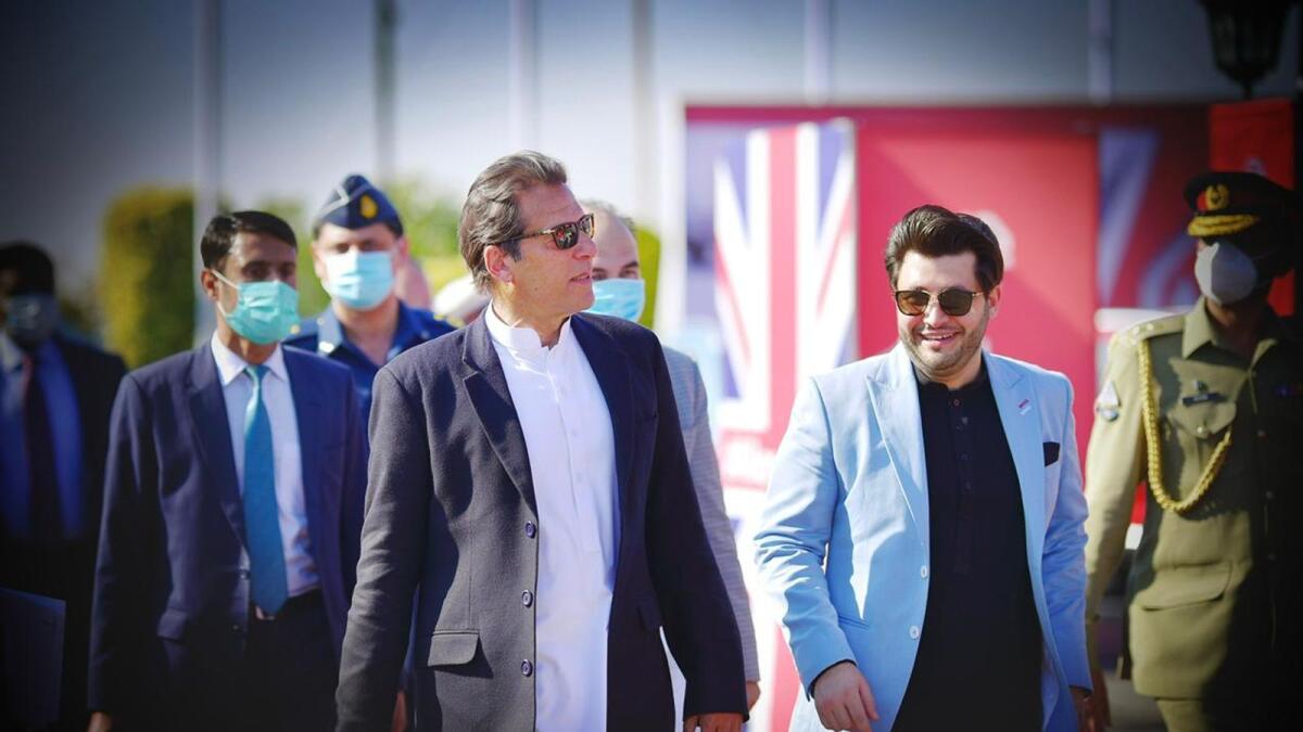 Prime Minister Imran Khan and Javed Afridi at an event to introduce electric vehicles in Pakistan.