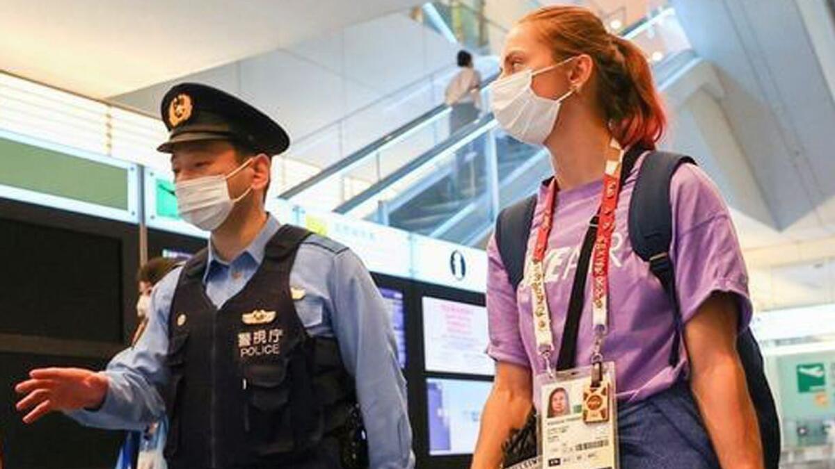 Belarusian athlete Kristina Timanovskaya with Japanese police.— Twitter