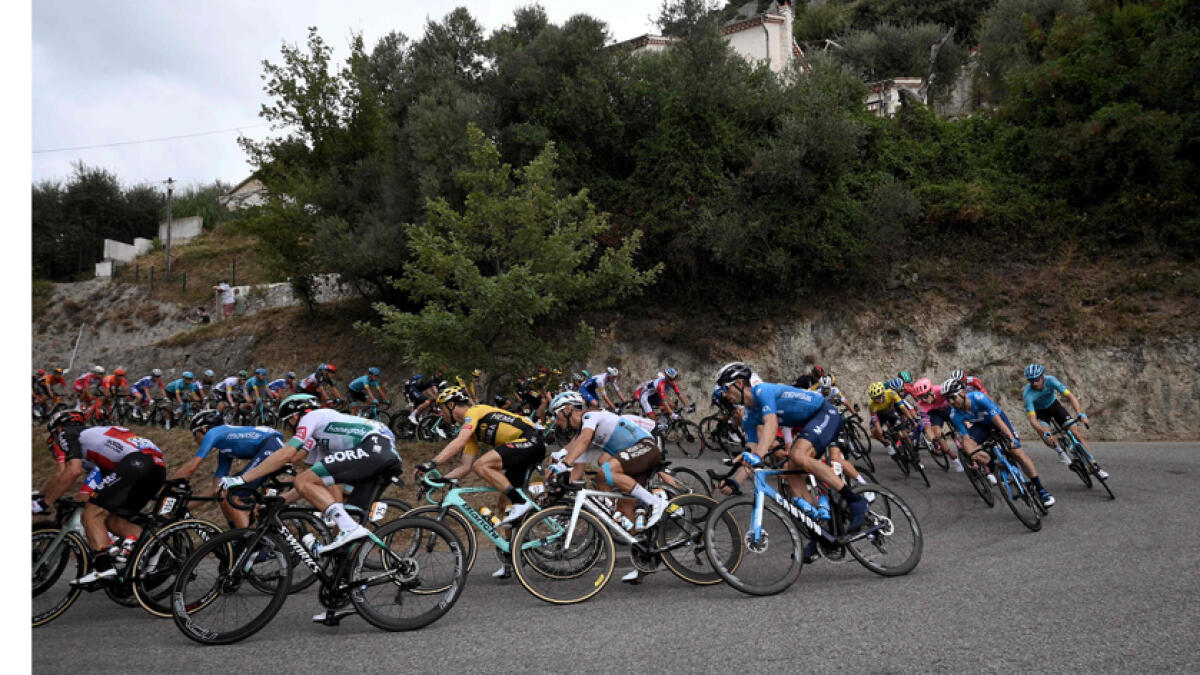 Cyclists compete during the first stage of the 107th edition of the Tour de France cycling race on Saturday. - AFP