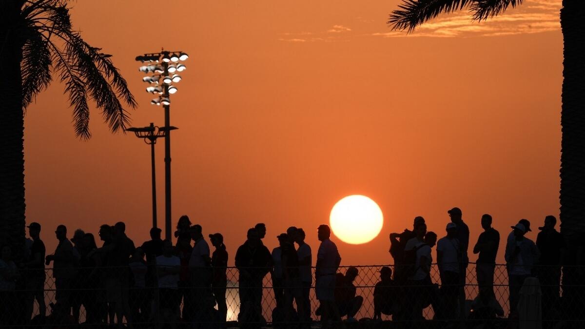 Spectators watch the sunset during qualifying for the Abu Dhabi Formula One Grand Prix at Yas Marina Circuit  Photo by Ryan Lim/Khaleej Times
