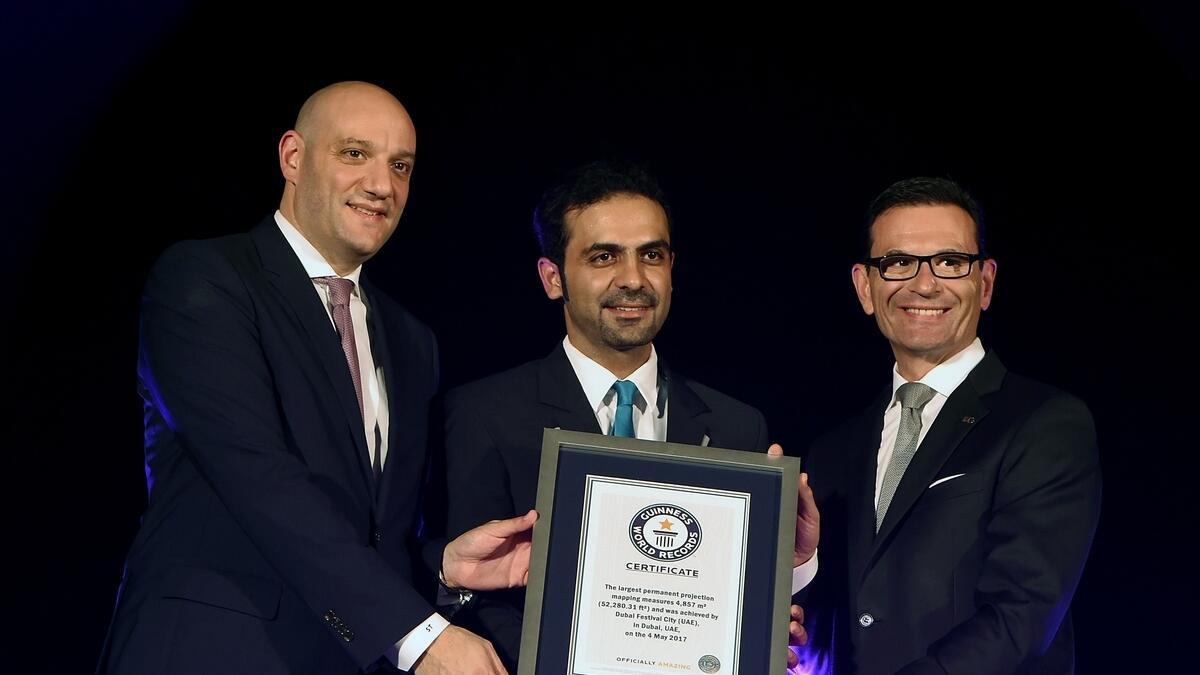 Sayed Tayoun and James Koratzopoulos from the InterContinental DFC accepting Guinness World Record