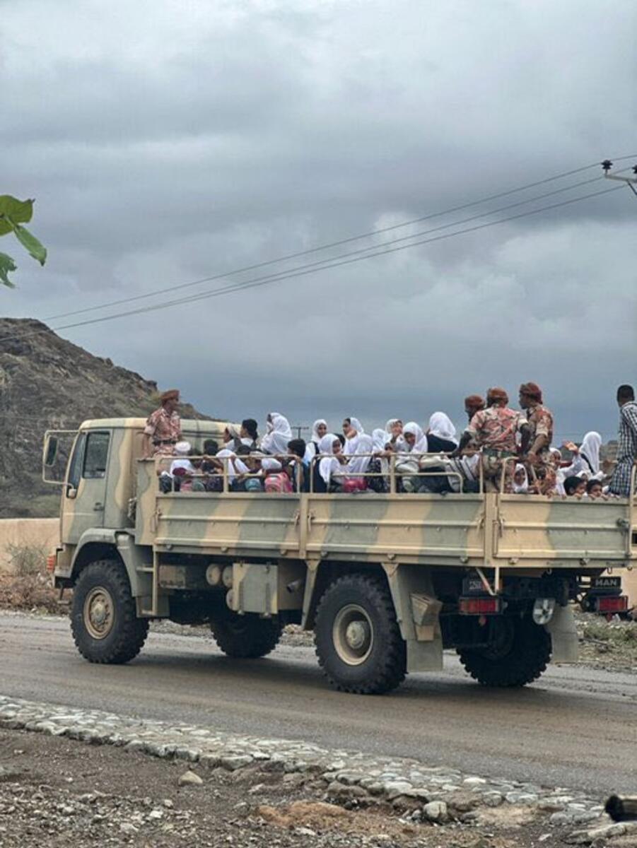 Royal Oman Police moves students and other stranded people from Rawda School in Al Ghazal area to a safe place. Photo: Royal Oman Police/X