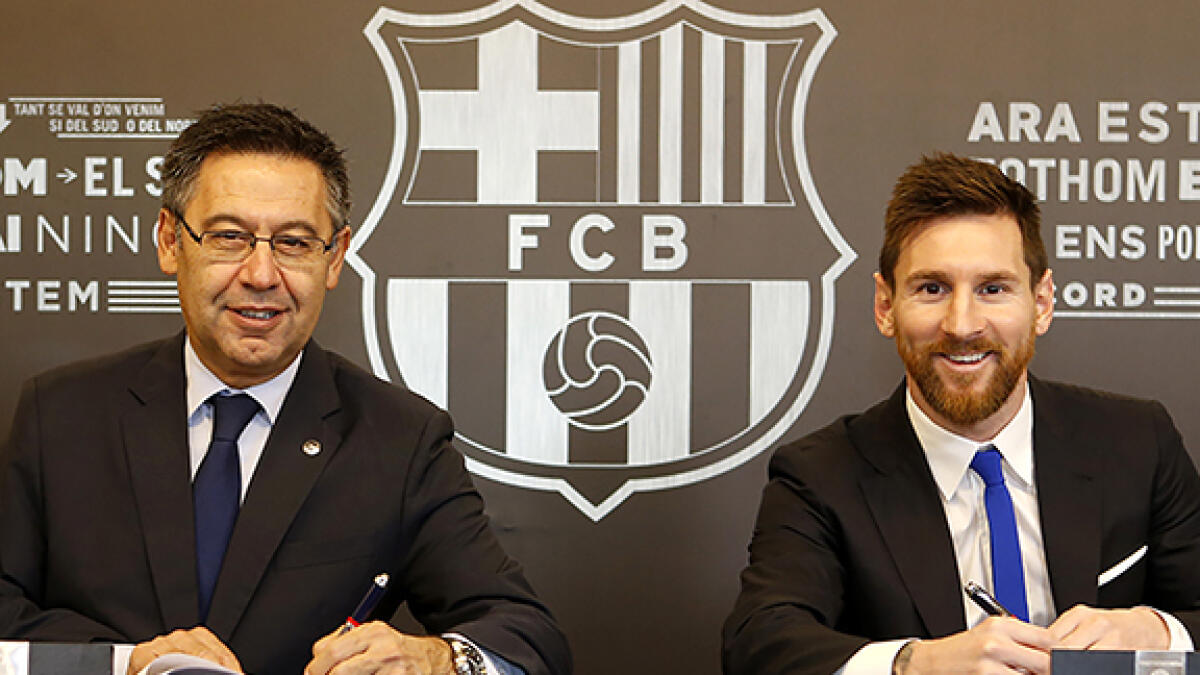 Josep Maria Bartomeu (left) said Lionel Messi is the best player in history. -- AFP