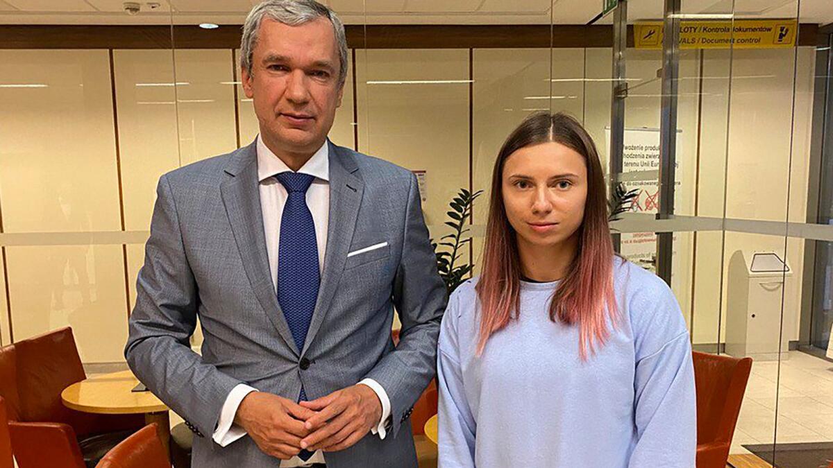 Belarusian Olympic sprinter Krystsina Tsimanouskaya (right) who seeks foreign refuge from Minsk authorities, poses for a photo with top Belarusian dissident in Poland, Pavel Latushko shortly after her arrival at the Frederic Chopin Airport in Warsaw, Poland. — AP