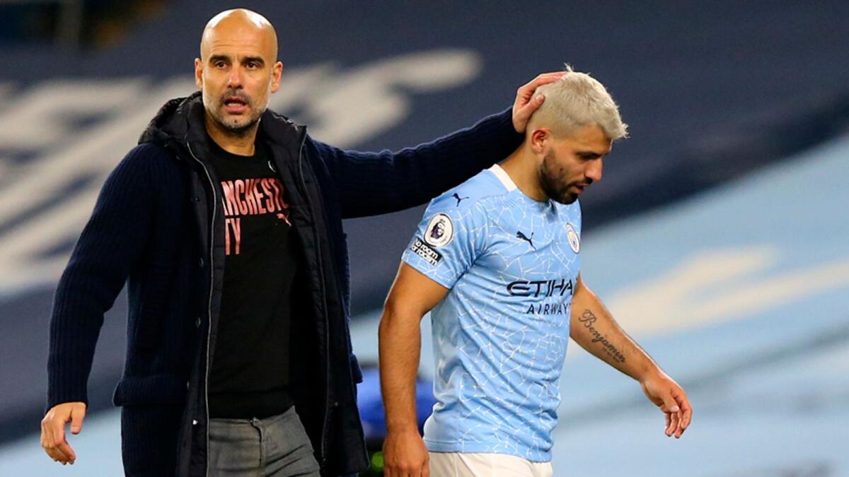 Aguero, who joined City from Atletico Madrid in 2011, will be out of contract at the end of the campaign and Guardiola (left) said negotiations over a new deal would have to wait until the summer. — AP