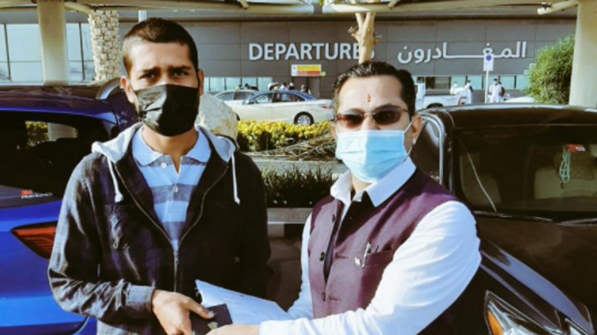Naresh Kumar with social worker Girish Pant at the Dubai International Airport.