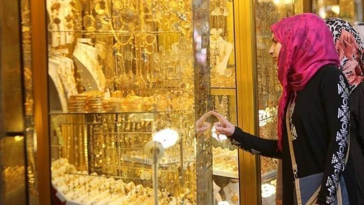 Gold gains on US data, Trump warning on Iran deal