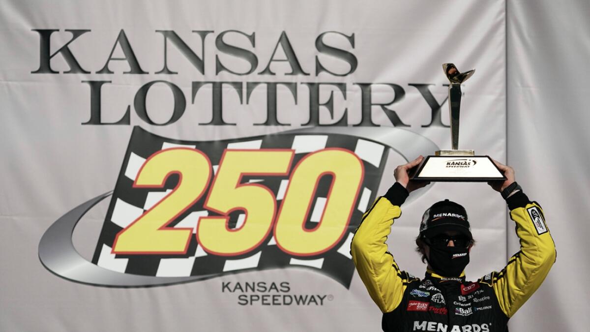 Brandon Jones celebrates after winning a NASCAR Xfinity Series auto race at Kansas Speedway in Kansas City. Photo: AP