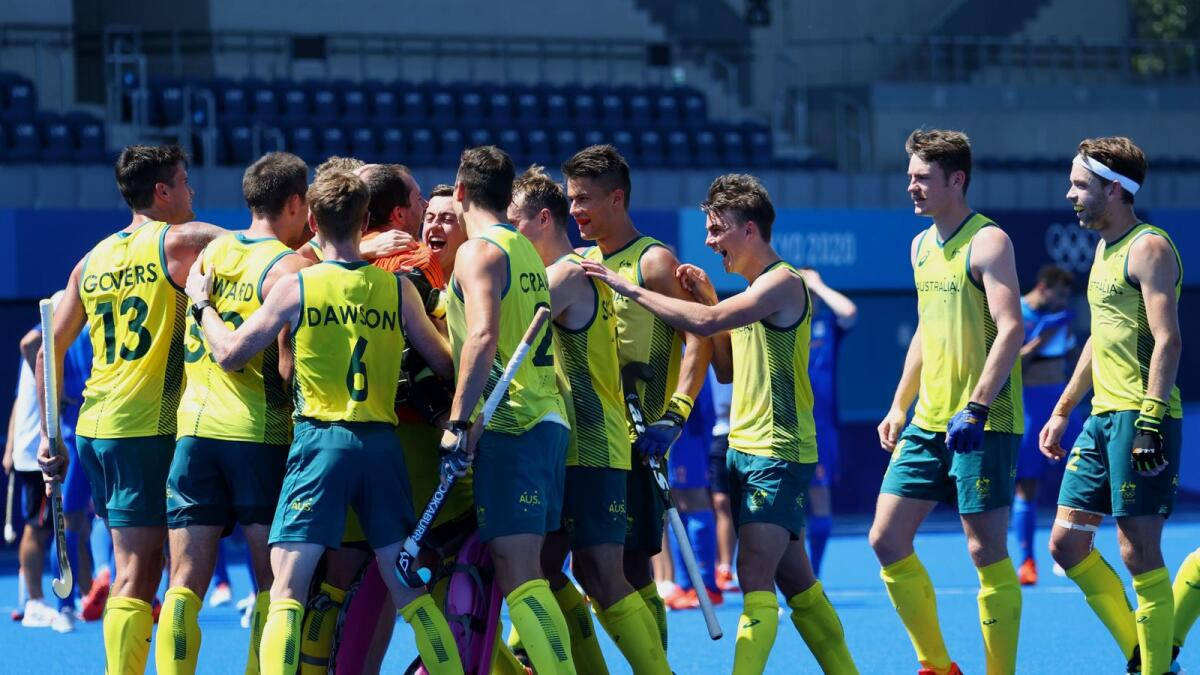 Players of Australia celebrate after winning their shoot-out against the Netherlands. — Reuters
