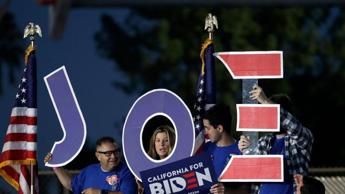 Supporters hold a sign before a campaign rally for Democratic presidential candidate former Vice President Joe Biden. AP