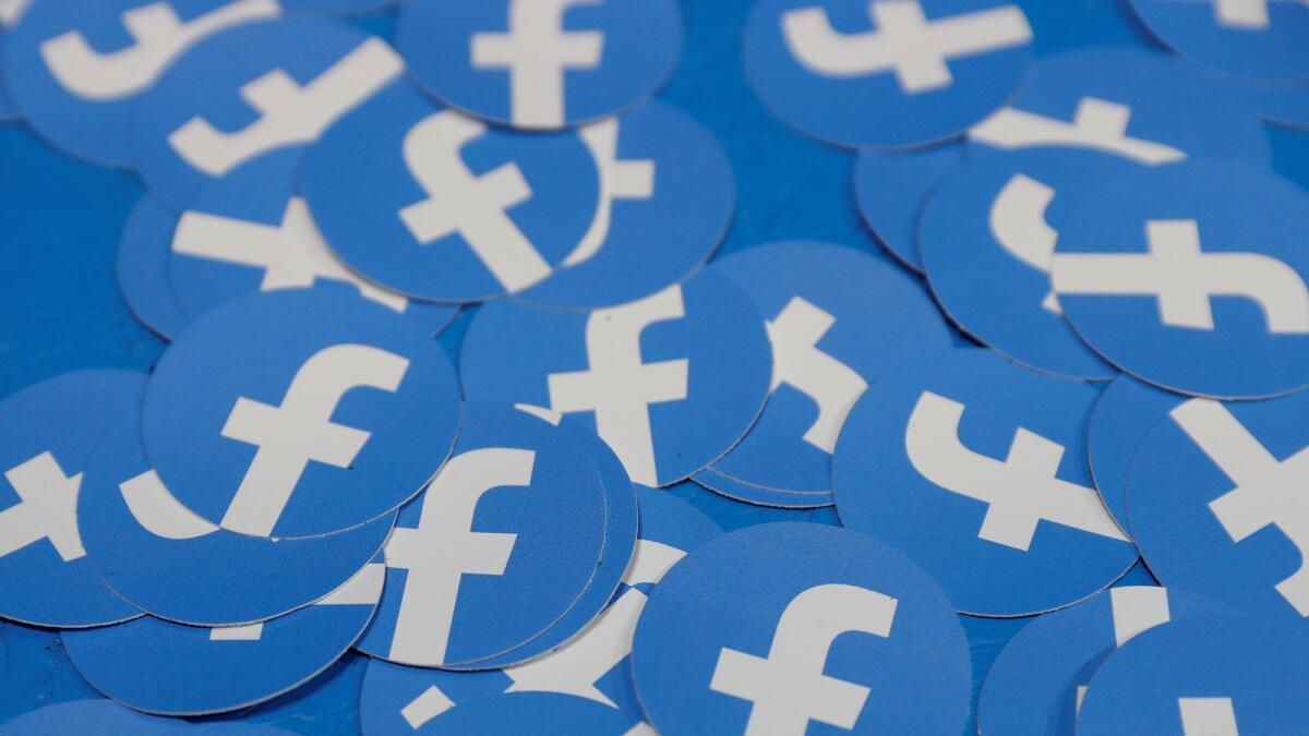 Stickers bearing the Facebook logo are pictured at Facebook Inc's F8 developers conference in San Jose, California. Facebook is also working on its own operating system for hardware devices. — Reuters file