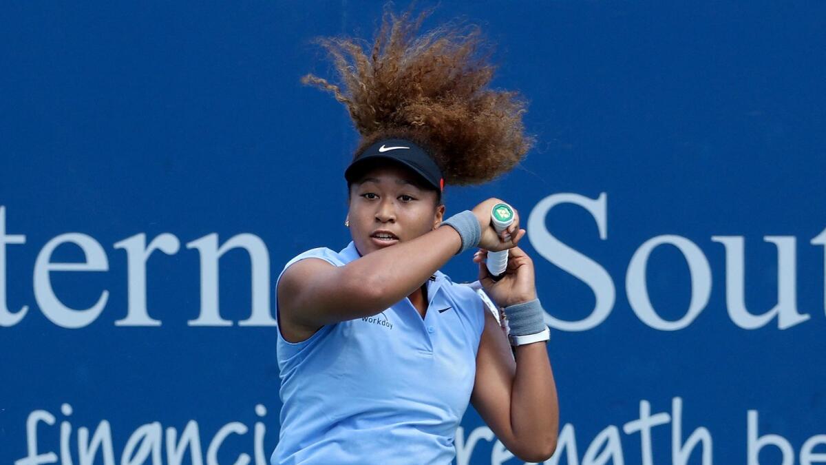 Naomi Osaka of Japan plays a forehand during her match against Coco Gauff. (AFP)