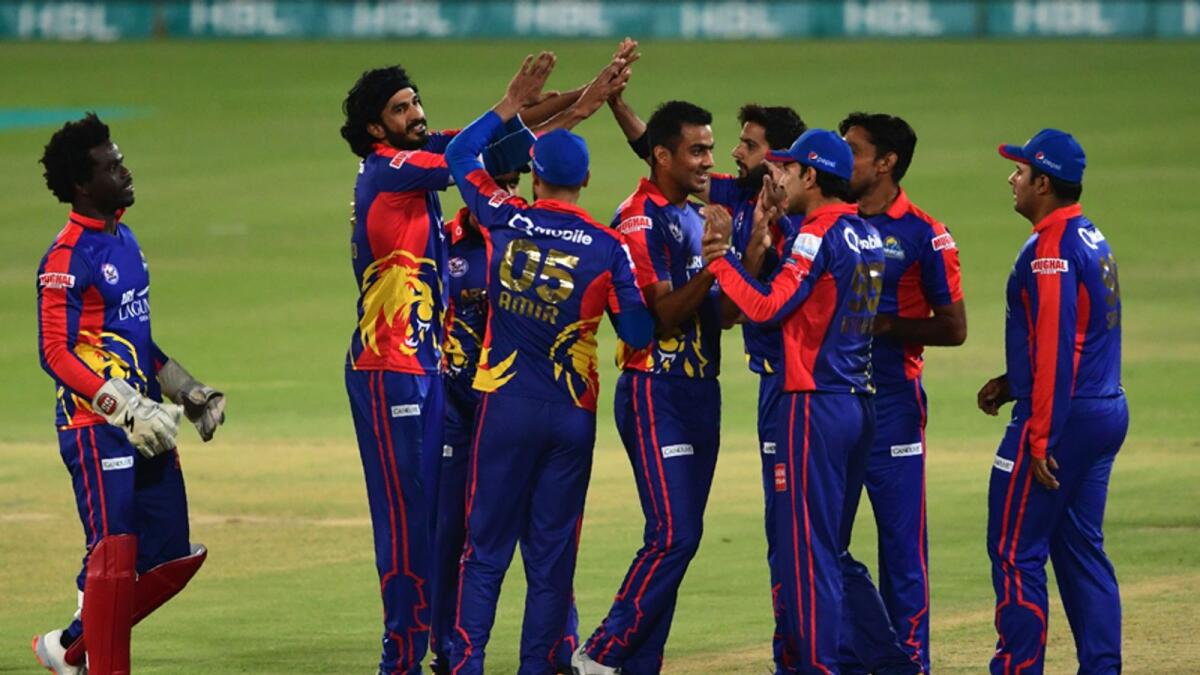 Karachi King's Umaid Asif (second left) celebrates with teammates after taking the wicket of Lahore Qalandars Fakhar Zaman during the Pakistan Super League Twenty20 final. — AFP