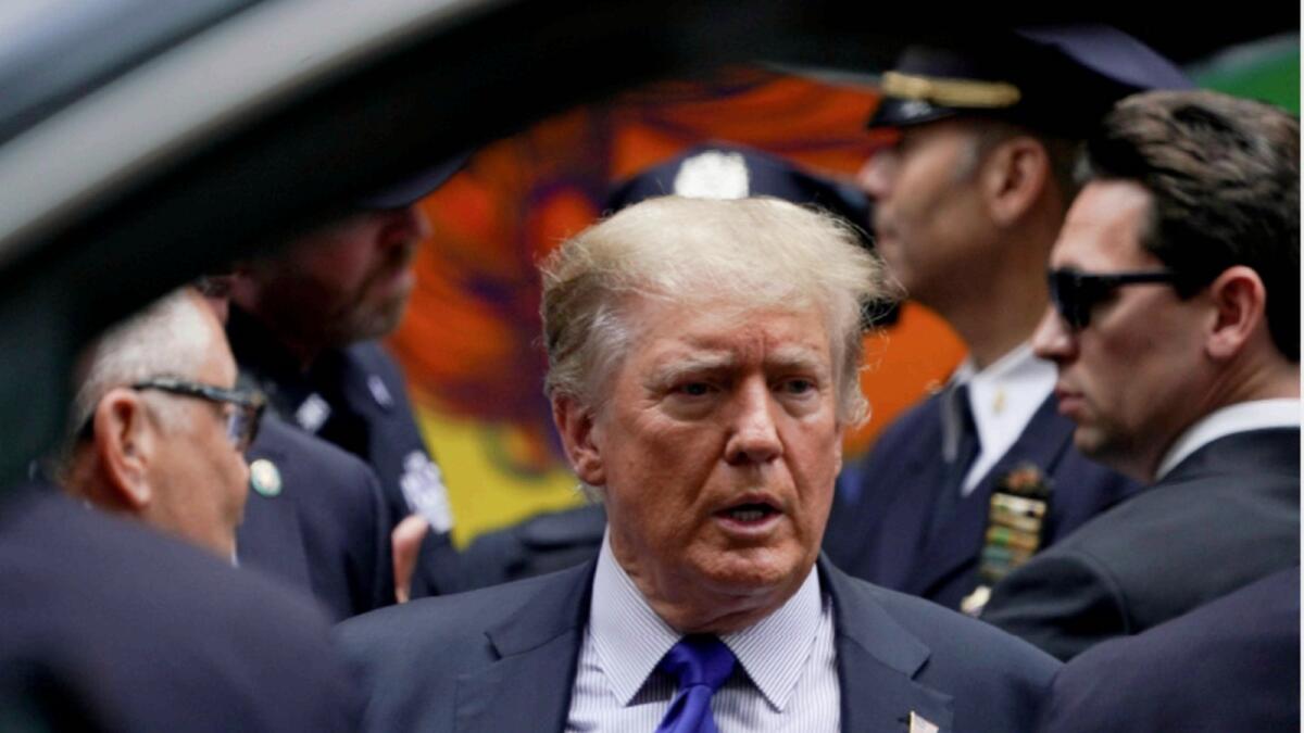 Former US President Donald Trump looks on as he visits the 17th Precinct of the New York City Police Department during the commemoration of the 20th anniversary of the September 11, 2001 attacks in New York City. — Reuters