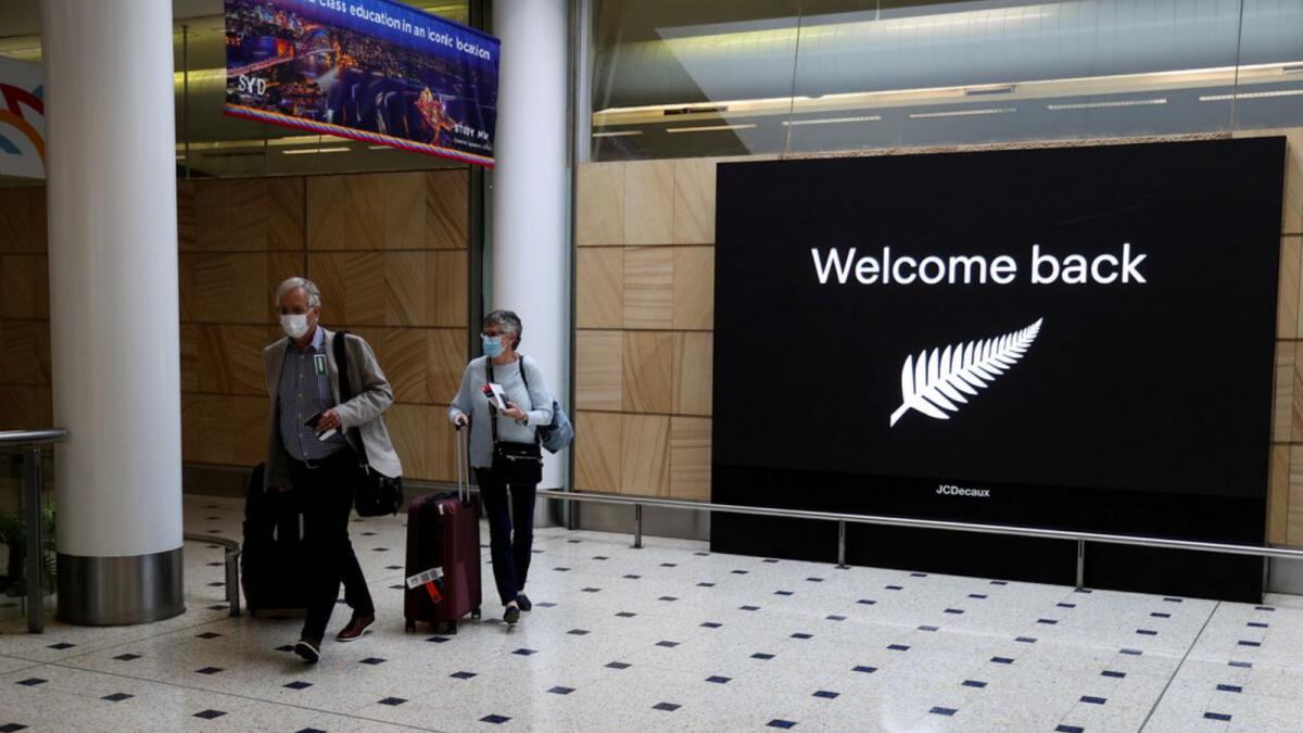 Passengers arrive from New Zealand after the Trans-Tasman travel bubble opened overnight, following an extended border closure due to the Covid-19 outbreak, at Sydney Airport in Sydney. Photo: Reuters