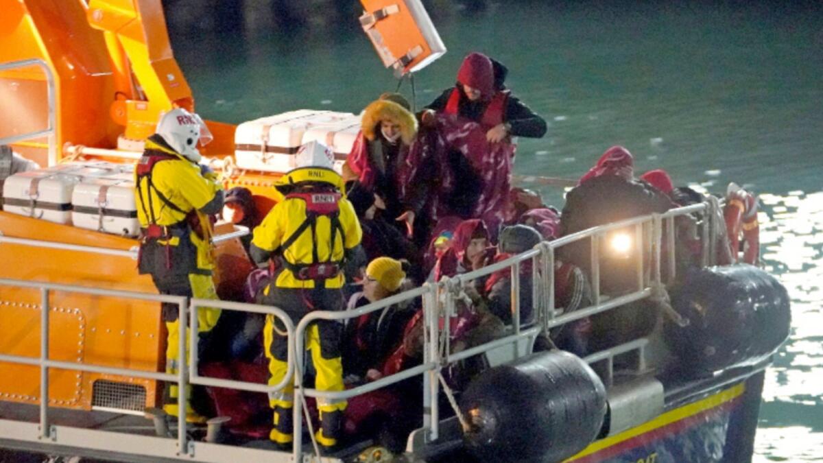 A group of people thought to be migrants are brought in to Dover, England, by the RNLI, following a small boat incident in the English Channel. — AP