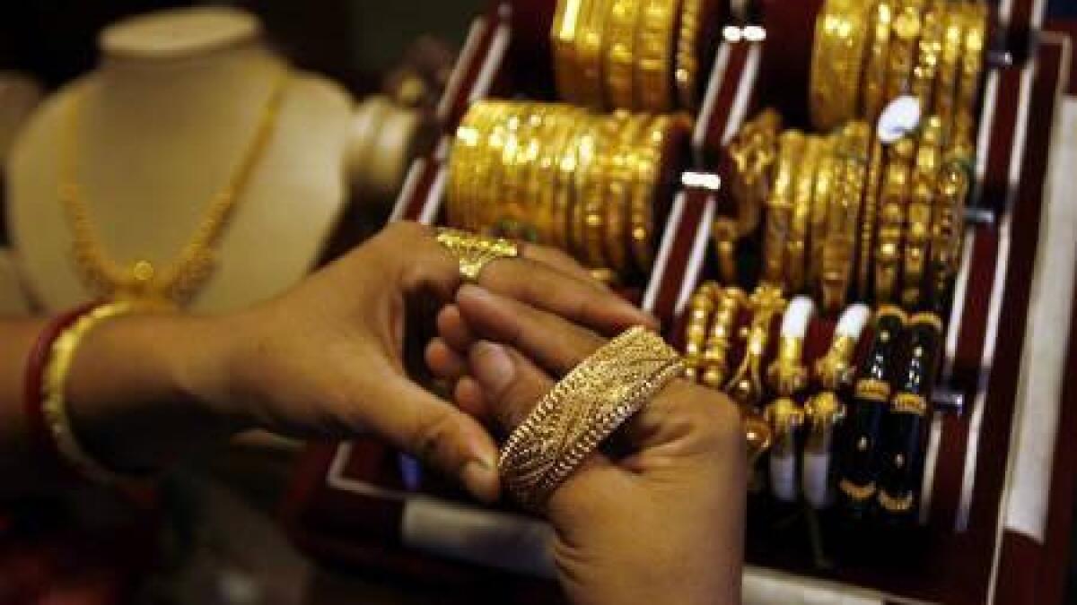 Spot gold was down 0.4 per cent at $1,951.24 per ounce. -  Reuters