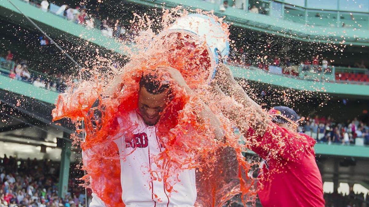 Boston Red Sox shortstop Xander Bogaerts (2) gets Powerade dumped on him after the Red Sox 6-5 win over the New York Yankees at Fenway Park. - AP