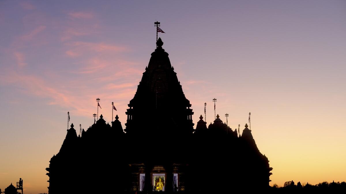 The sun sets at the BAPS Swaminarayan Akshardham. — AP
