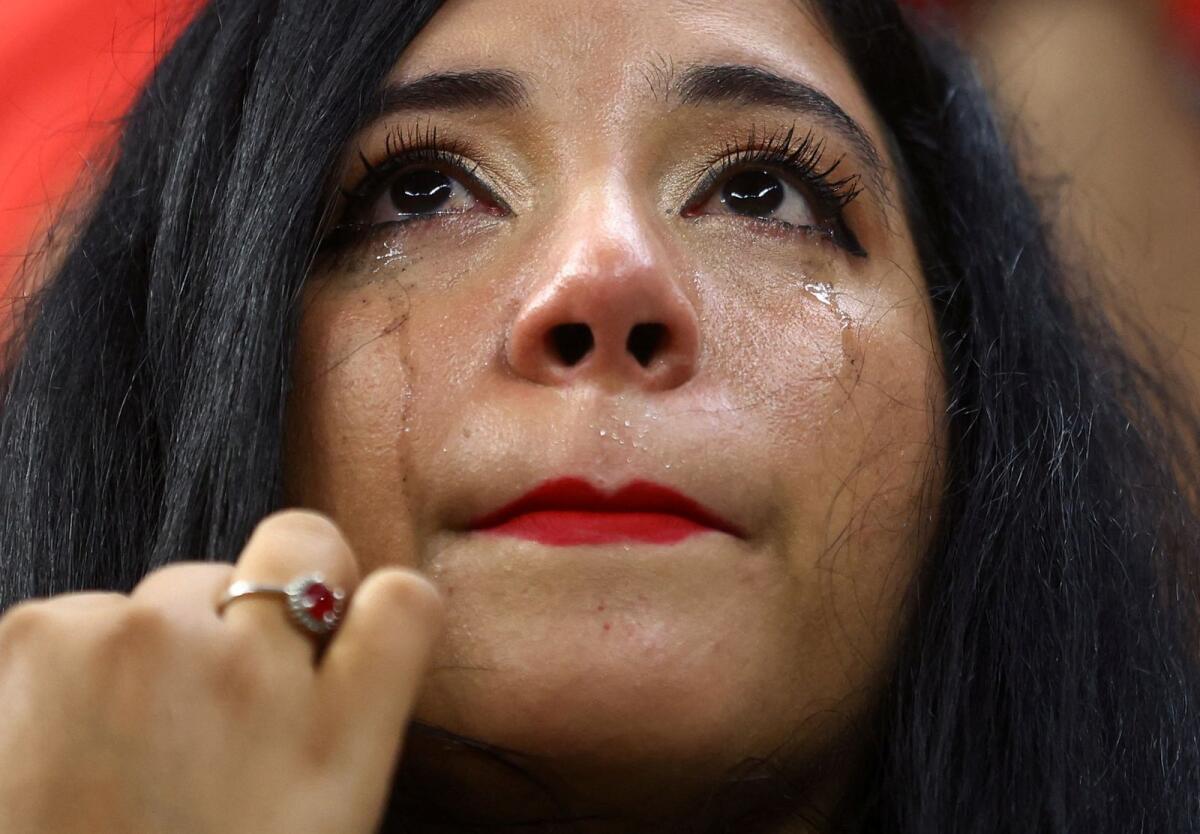 Morocco fan looks dejected after the match as Morocco are eliminated from the World Cup. Photo: Reuters