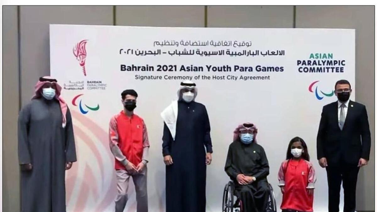 Para athletes Ahmed Alhindawi and Zainah Abdulqadeer with the officials at the signing ceremony. — Supplied photo