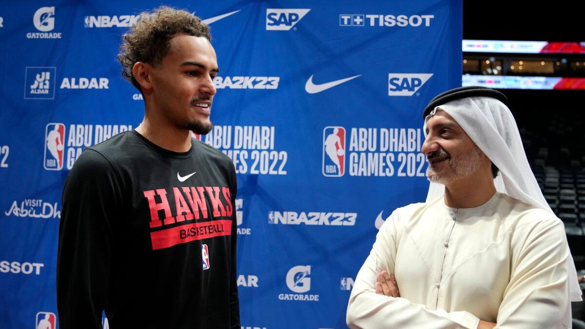 Atlanta Hawks guard Trae Young (left) talks to Saleh Al Geziry, Director General of Tourism at Department of Culture and Tourism, during a training session ahead of the NBA pre-season basketball game against the Milwaukee Bucks in Abu Dhabi. — AP