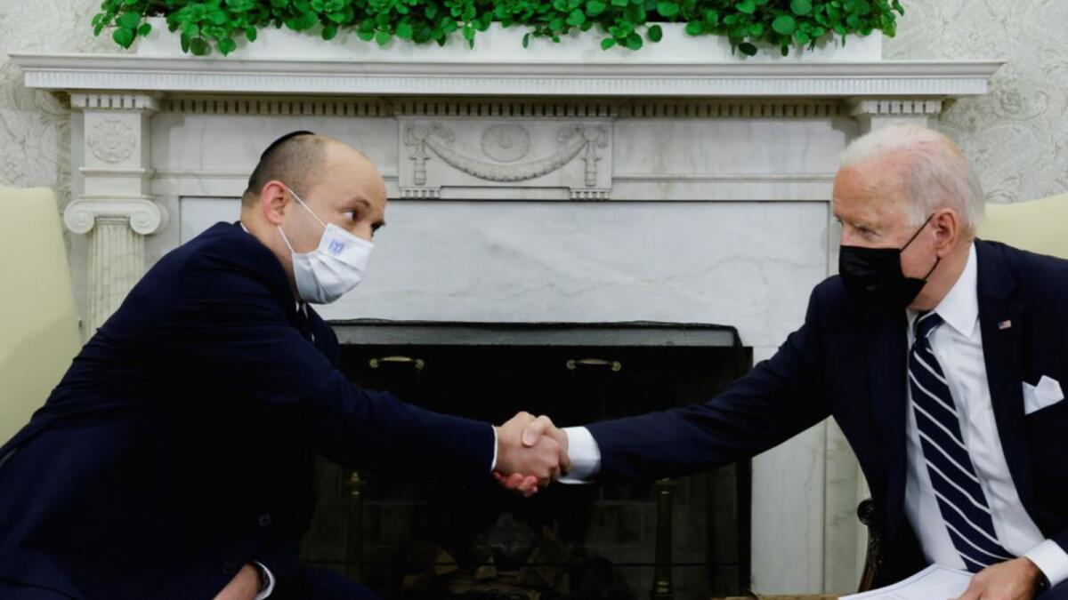 US President Joe Biden and Israel's Prime Minister Naftali Bennett shake hands during a meeting in the Oval Office at the White House in Washington. Photo: AFP