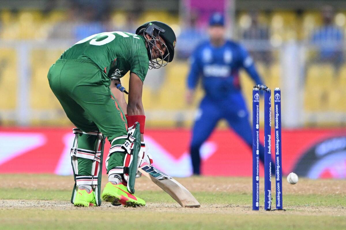 Bangladesh's Mahedi Hasan looks at the stamps after being bowled by England's Reece Topley. — AFP