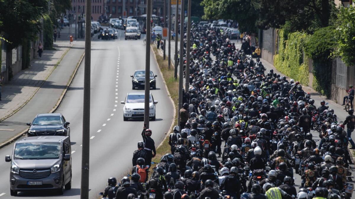Thousands of motorcyclists ride in convoy in Nuremberg, Germany. They demonstrate against possible driving bans on Sundays and holidays. The background is a resolution of the Bundesrat, the upper house of the German parliament, which calls on the federal government to enforce such temporary restrictions. Photo: AP