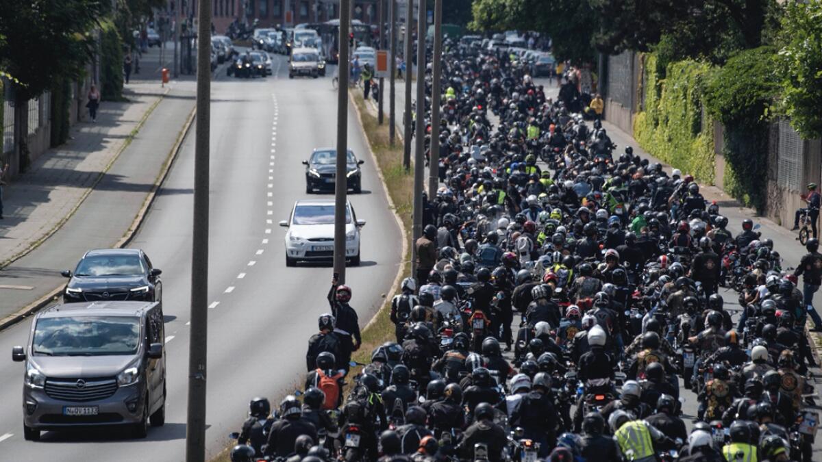 Thousands of motorcyclists ride in convoy in Nuremberg, Germany. They demonstrate against possible driving bans on Sundays and holidays. The background is a resolution of the Bundesrat, the upper house of the German parliament, which calls on the federal government to enforce such temporary restrictions. Photo: AP