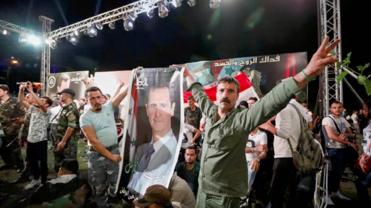 Supporters of President Bashar Al Assad celebrate in Syria. Photo: Reuters