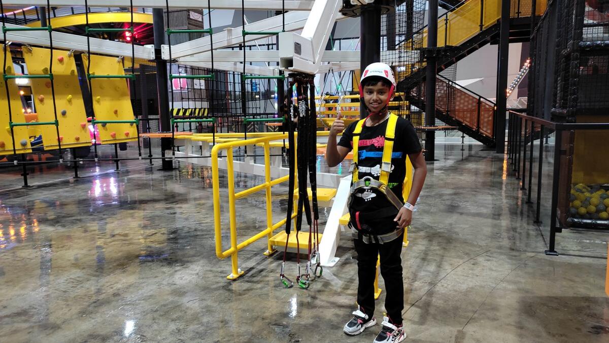A child at rope course of Adrenark Adventure.